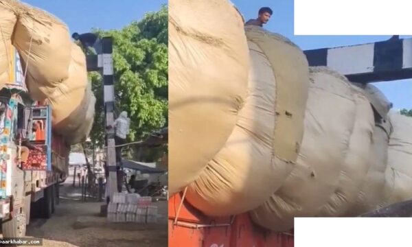 रेलवे क्रॉसिंग पर फंसा भूसे से लदा ट्रक