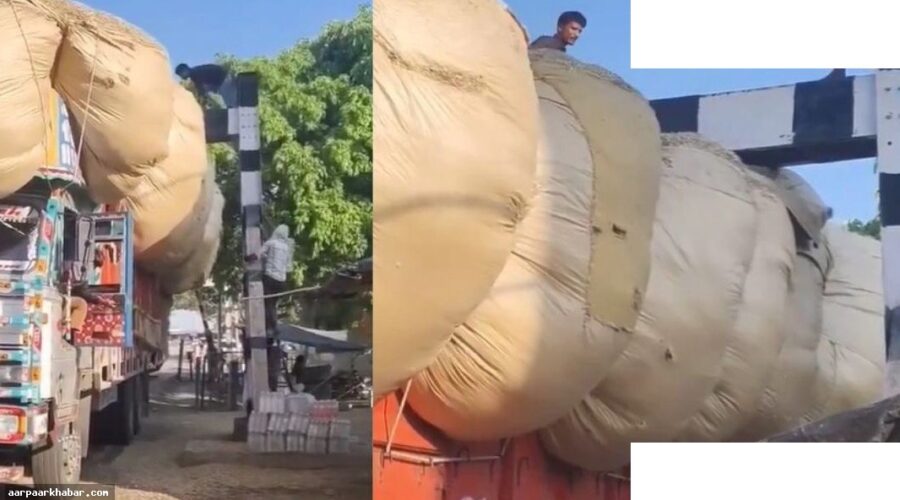 रेलवे क्रॉसिंग पर फंसा भूसे से लदा ट्रक